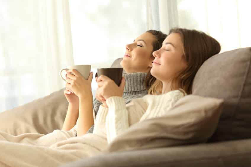 Women breathing fresh air at home