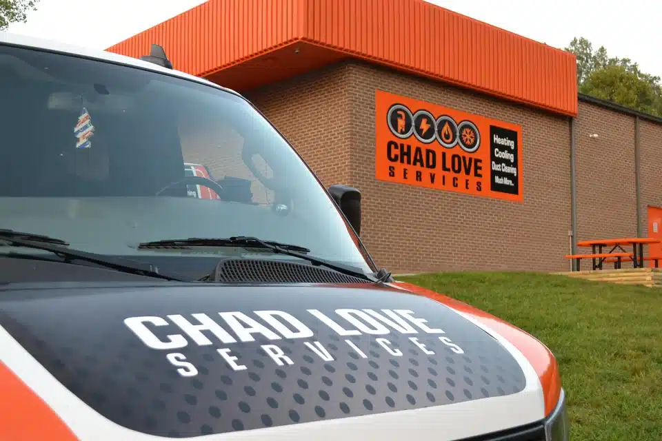Chad Love Services Truck outside of their office