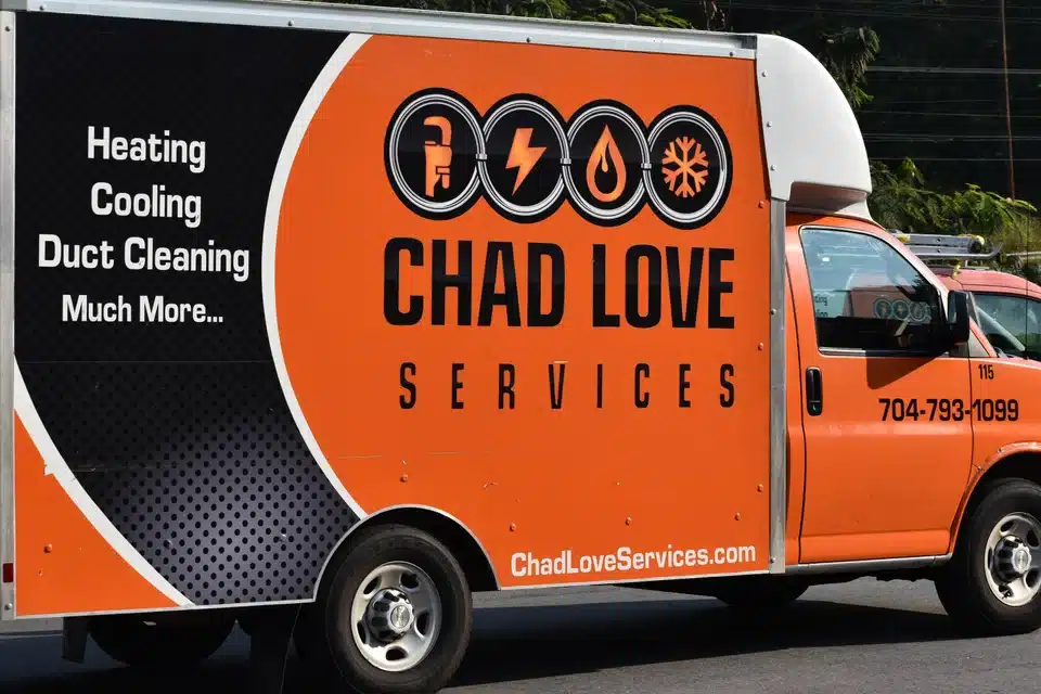Chad Love Services van parked outside of a Davidson, NC home