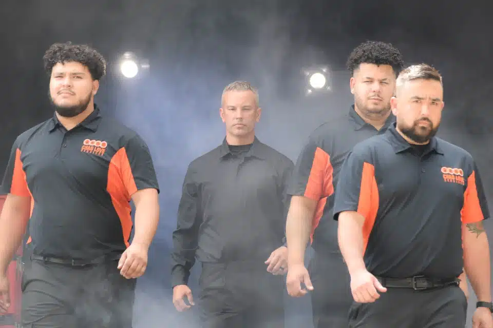 Chad and team of Chad Love walking out of mist