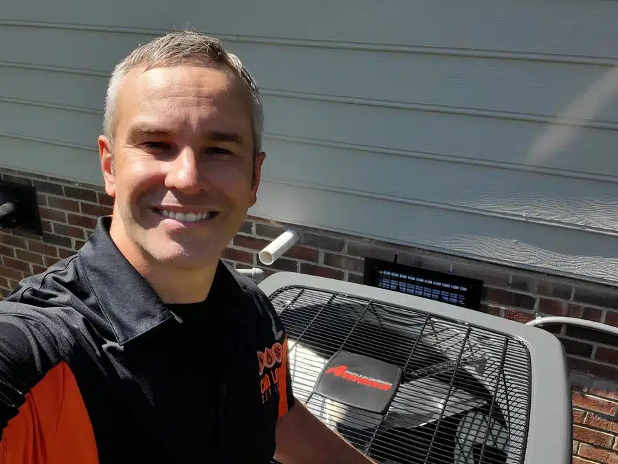 Chad Love installing AC unit