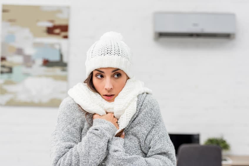 A woman who's heating isn't working.