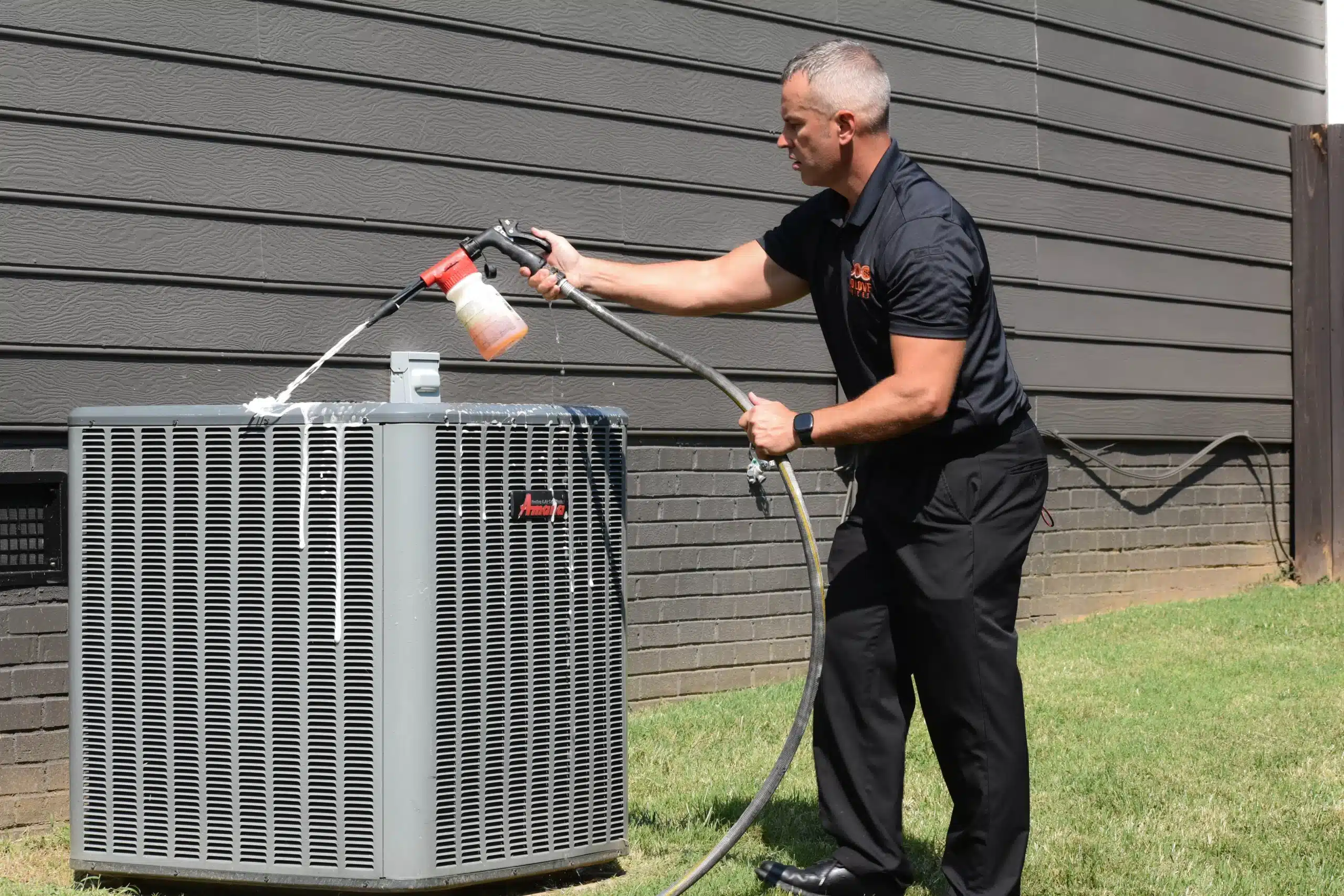 HVAC Technician performing residential AC repair in Charlotte, NA