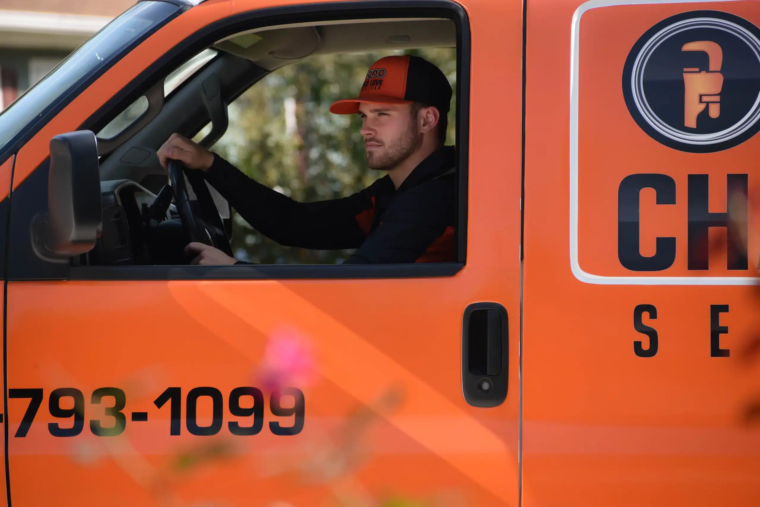 HVAC technician driving a Chad Love Services van in Davidson, NC