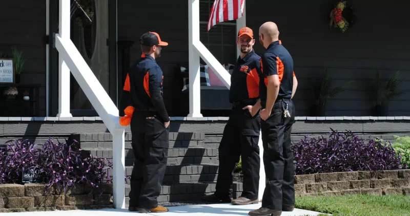Chad Love services techs standing outside residential home in Concord, NC.
