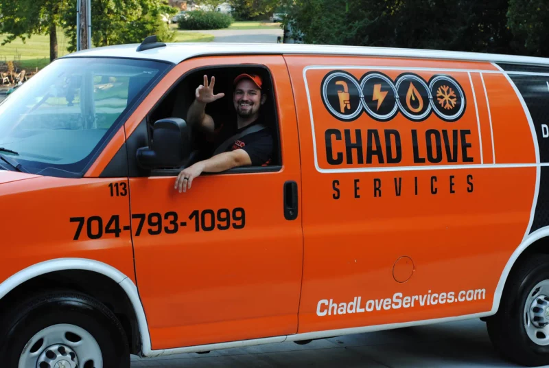 Chad Love truck with smiling technician in Concord, NC.